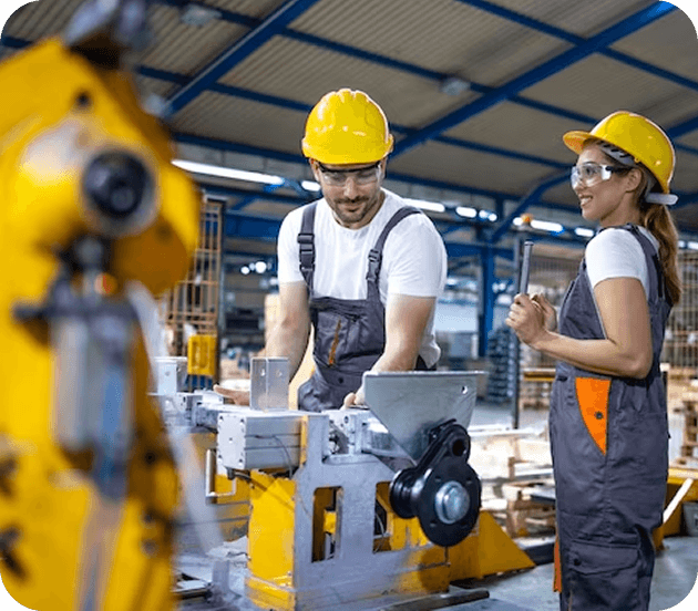 Industrial workers discussing in factory